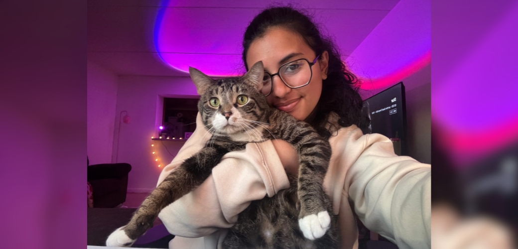 Adopter holding her cat