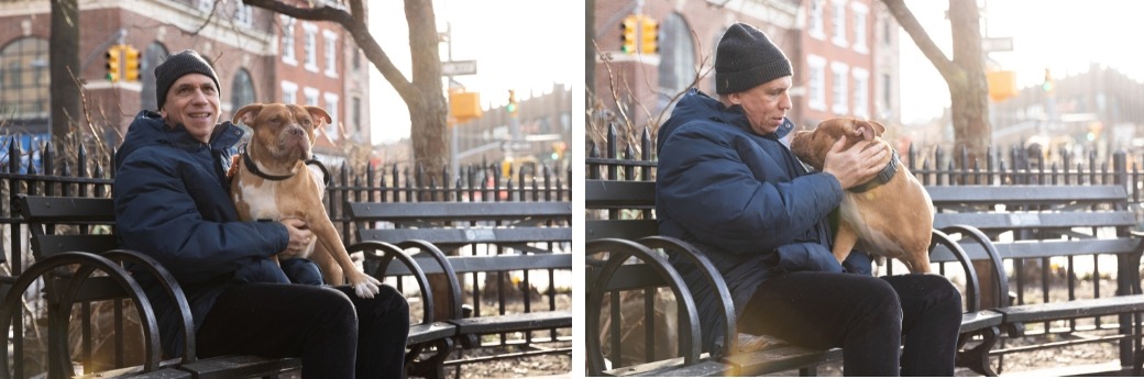 tan pit bull and his adopter sitting outside on a bench